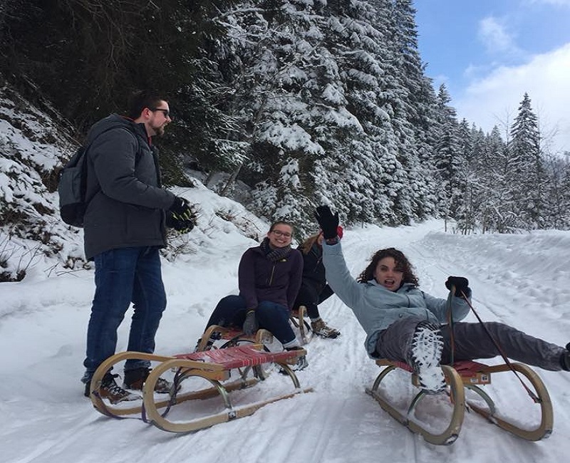 Students sledding in Austria