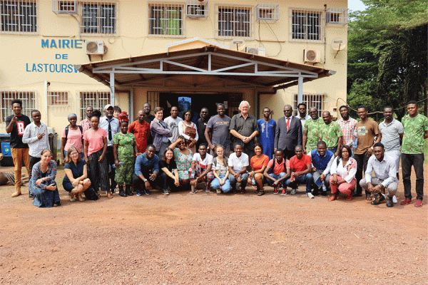 University of New Orleans biology professor Nicola Anthony, far left in blue, conducted research in Gabon, Africa as part of a field training school. This photo was taken in front of the mayor鈥檚 office in Lastourville. 